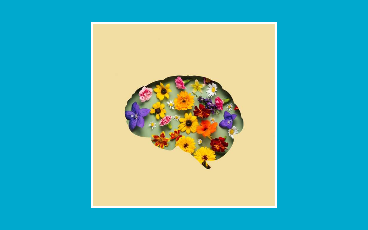 flores dentro de una silueta en forma de cerebro